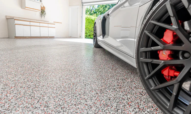 Finished flake epoxy garage floor with high-gloss topcoat ready for use in Camarillo, CA